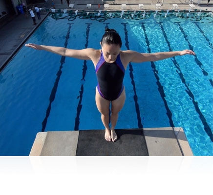 Nikon 1 V3 photo of a woman on a high diving board over the pool
