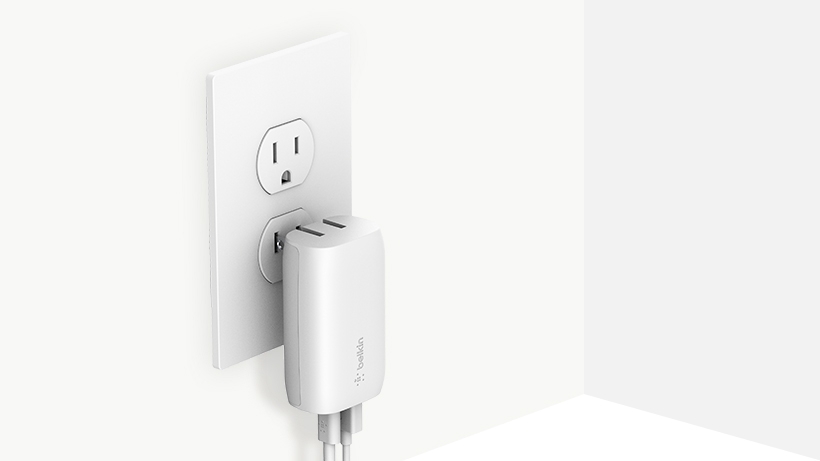BOOSTCHARGE Wall Charger being plugged into a wall outlet